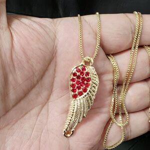 Gold Wing Pendant Necklace with Red Accents